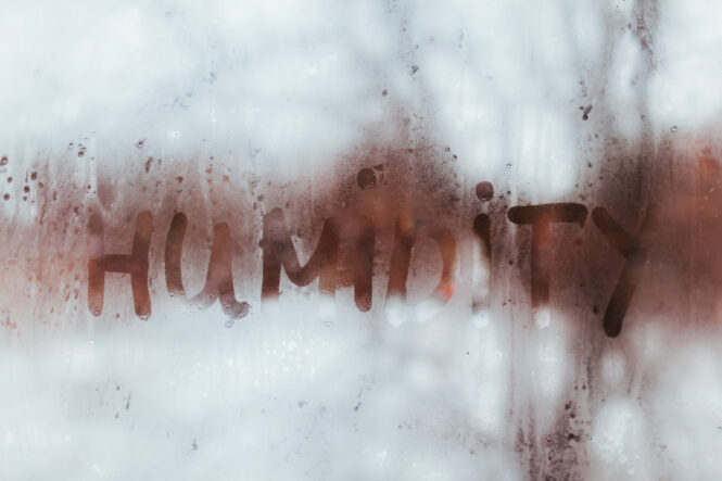 humidity written with a finger in a foggy window